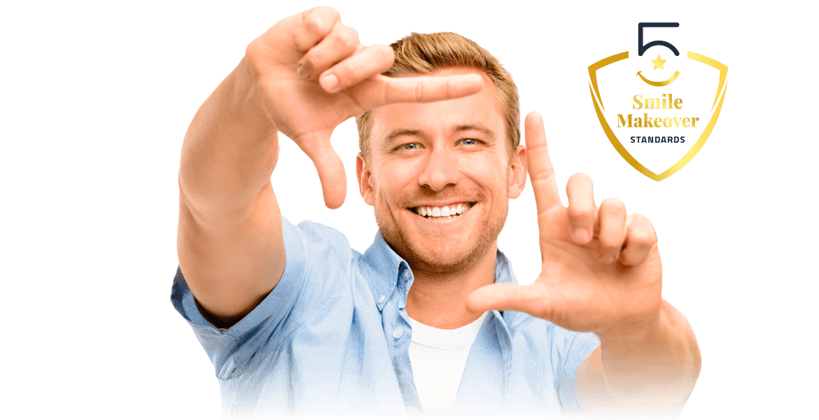 A man smiling at the camera to show his natural-looking teeth, next to the 5 Smile Makeover Standards badge.