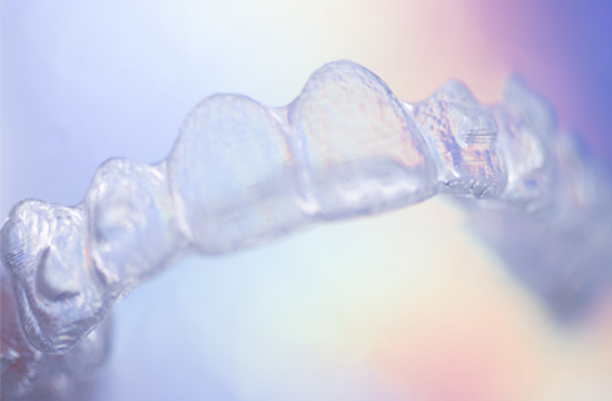 A clear aligner used to straighten teeth.